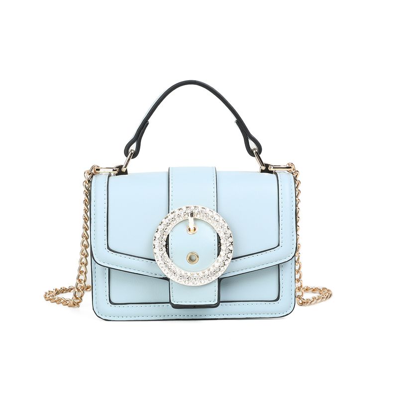 FELICIA Clutch med stor glitterspenne - lys blå