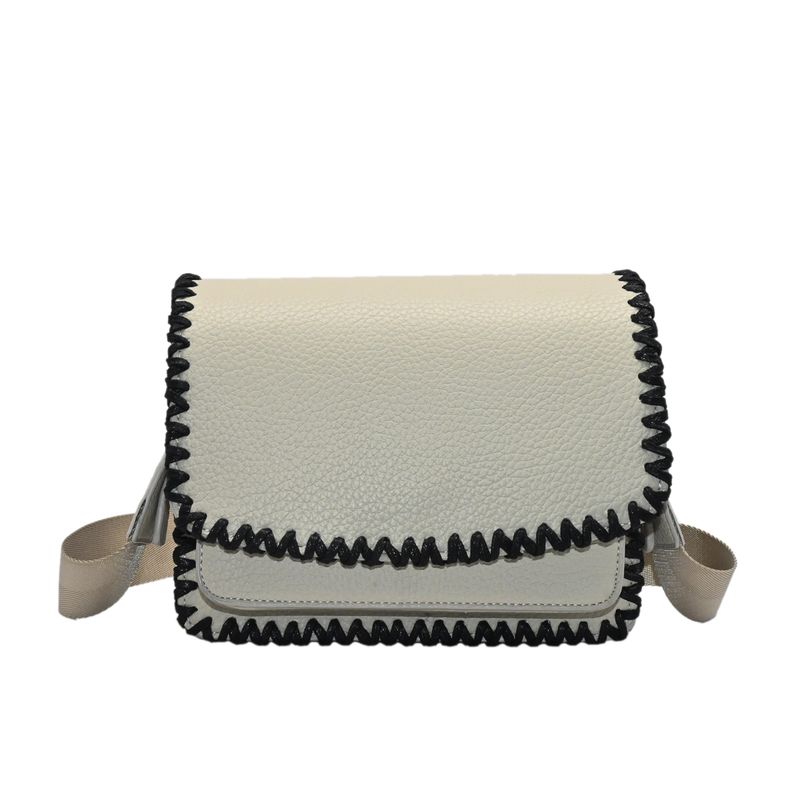 CAMILLE clutch med søm - beige